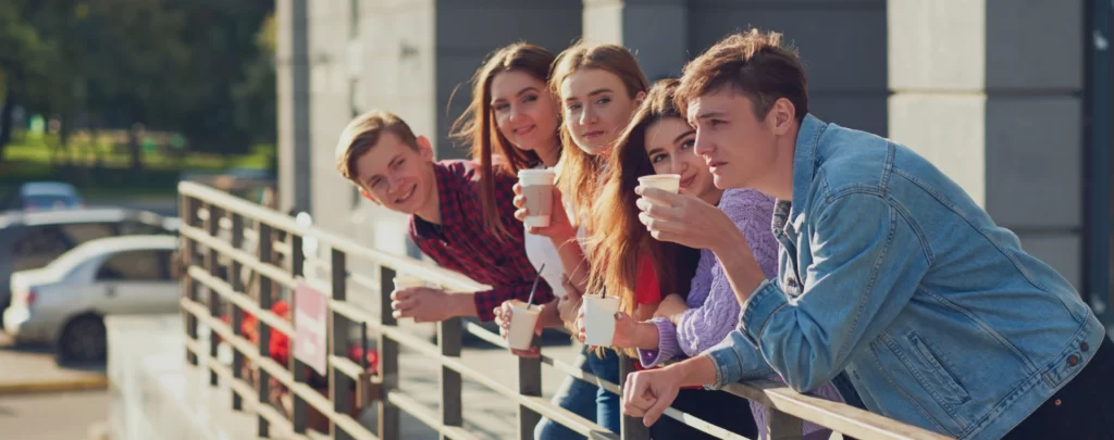 students-enjoying-cup-coffee-go-street-young-people-morning-outdoor-with-cup-energy-drink-1-1024x405